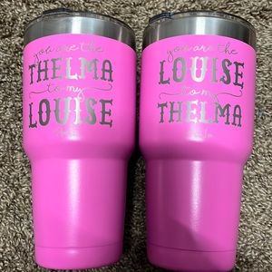 2 medium size hot pink tumblers with “You are the Thelma to my Louise”